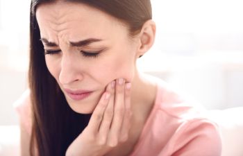 A woman with tooth pain