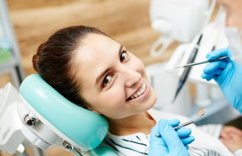 Woman Smiling in a Dental Chair