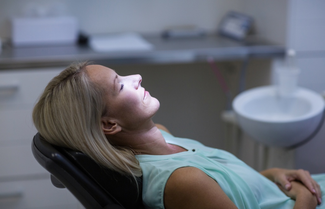 Woman relaxing on dentist chair in dental clinic, Indian Land, SC